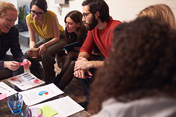 istock Designers Sitting On Sofa Having Creative Meeting In Office 626261202
