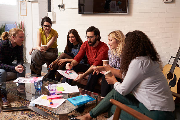 istock Designers Sitting On Sofa Having Creative Meeting In Office 626261352