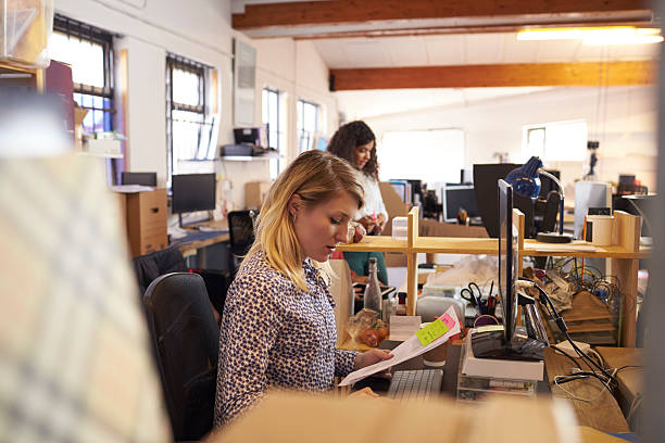istock Female Designer Working At Desk In Busy Office 626261374