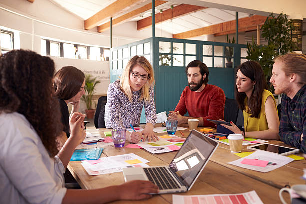 istock Female Manager Leads Brainstorming Meeting In Design Office 626261496