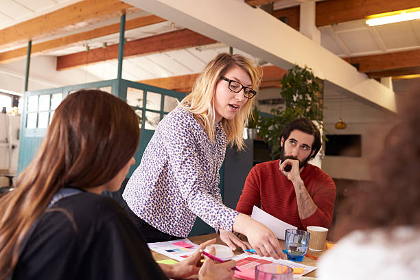 istock Female Manager Leads Brainstorming Meeting In Design Office 626261504