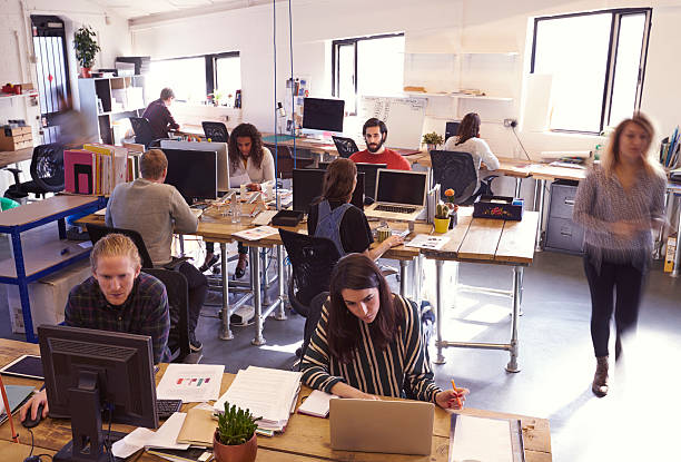istock Interior Of Busy Design Office With Staff 626262056