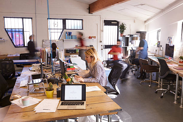 istock Interior Of Busy Design Office With Staff 626262070