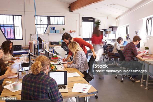 Interior Of Busy Design Office With Staff Stock Photo - Download Image Now - Office, Busy, Working