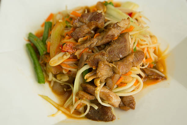 istock Papaya salad roasted pork closeup 626262100
