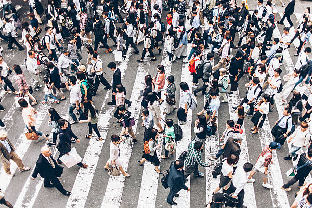 istock People crossing street on walkway 626263144