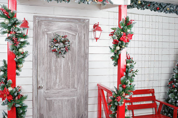 istock Christmas wreath on door in the interior 626264018