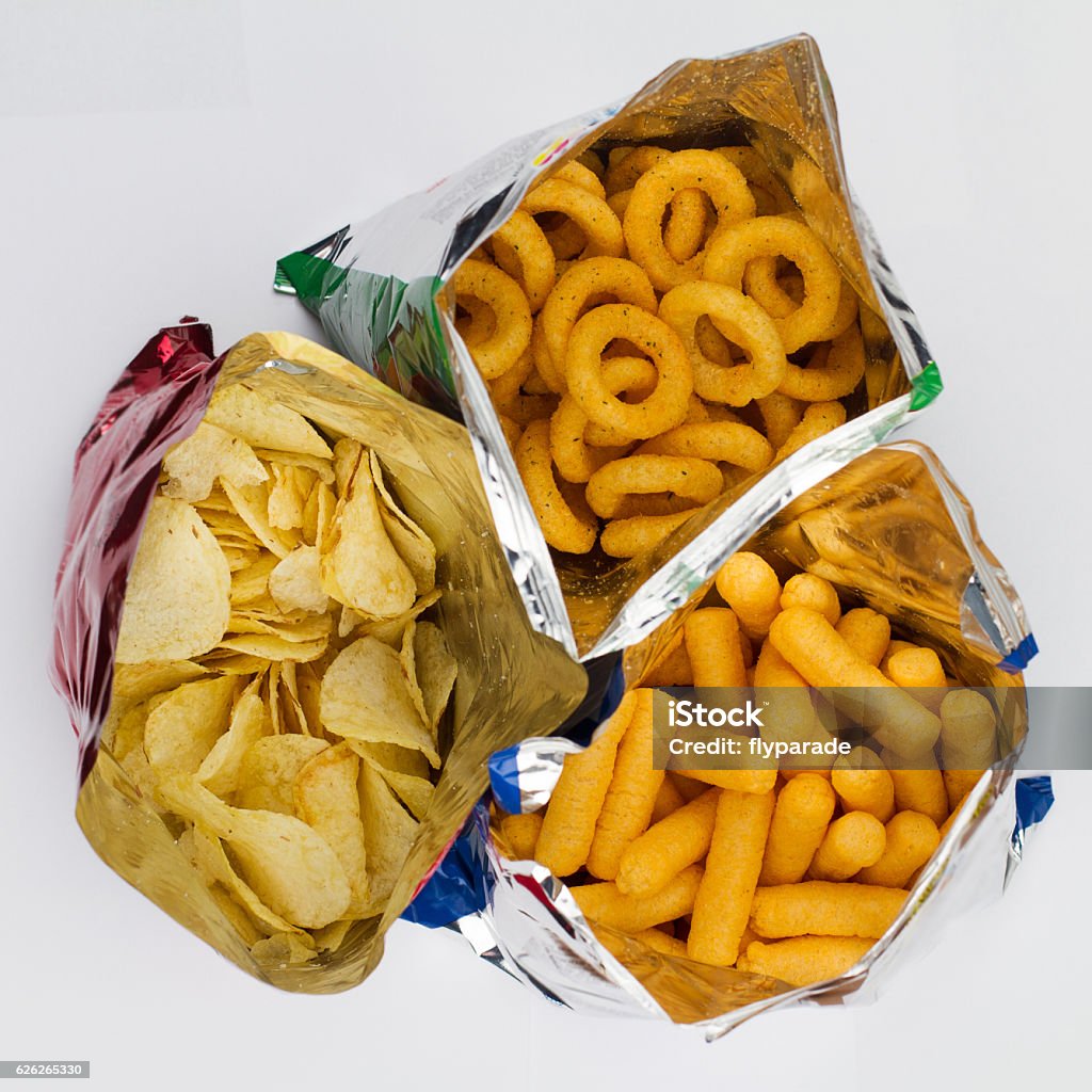 open bags of potato chips top view of three open bags of chips of different sizes, colors and textures Potato Chip Stock Photo