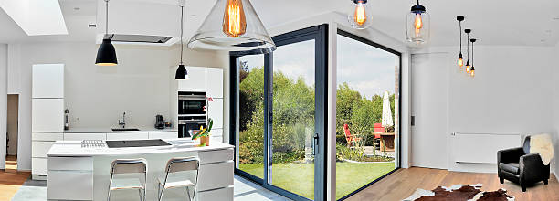 istock Modern kitchen from loft with view on a lush garden 626265644
