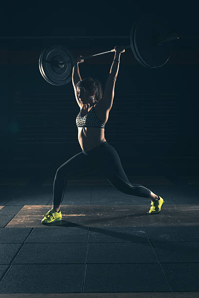 weightlifting strong woman on a gym stock photo