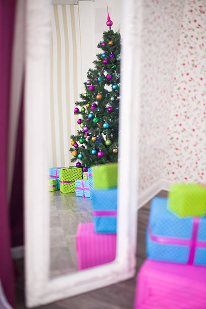 istock Christmas tree and gifts reflected in the mirror 626266036
