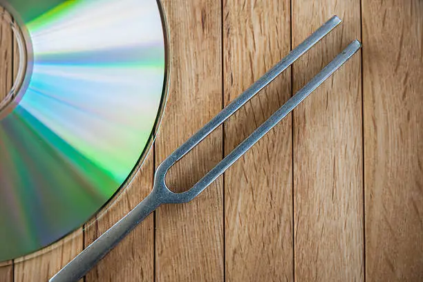 Photo of Compact Disc and Tuning Fork