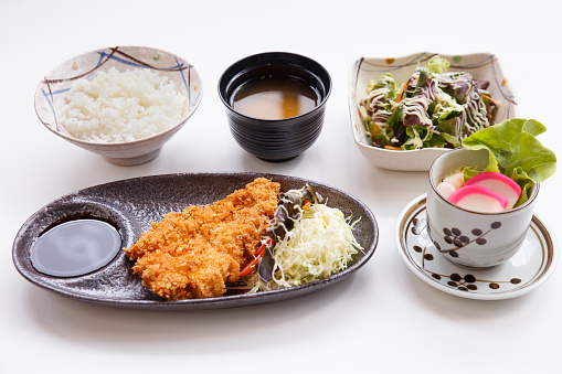 Tonkatsu Set Served with Japanese Steamed Rice, Miso Soup, Salad, Japanese Steam Egg and Tonkatsu.