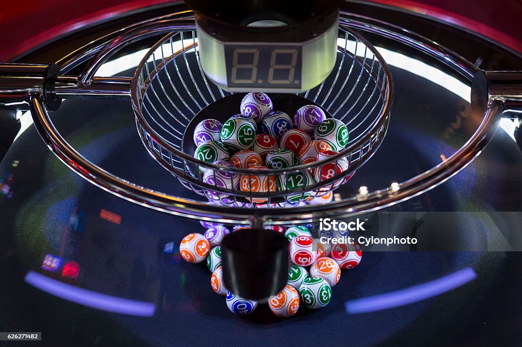 Colourful lottery balls in a lotto machine Colourful lottery balls in a lotto machine. Gambling machine and euqipment. Number Stock Photo