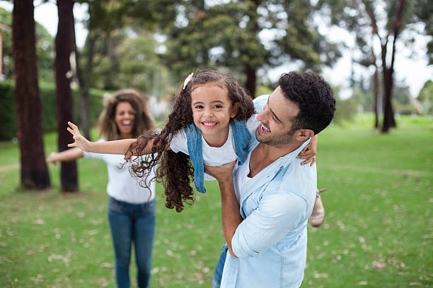 family playing in the park