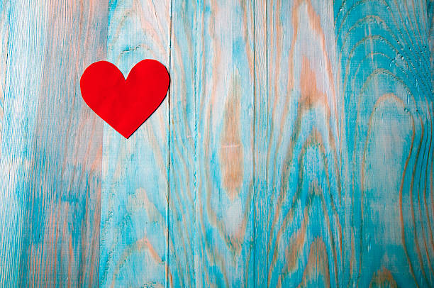 istock Paper heart on blue wooden background. Copyspace 626288004
