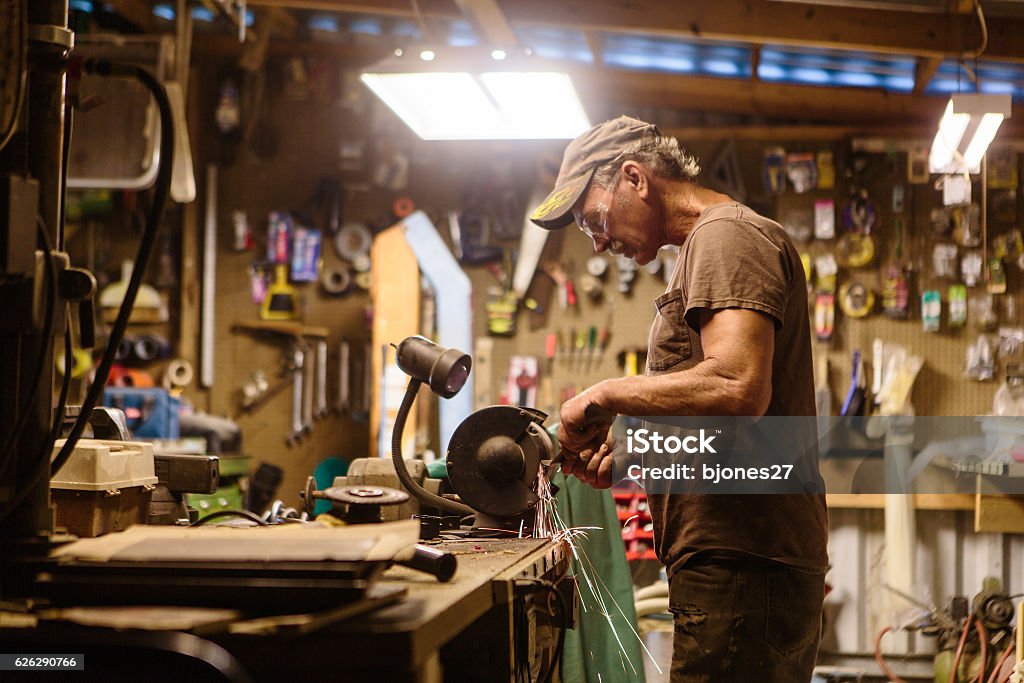 Mechanic working in garage shop mechanic working in garage shop Auto Repair Shop Stock Photo