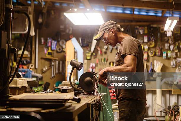 Mechanic Working In Garage Shop Stock Photo - Download Image Now - Auto Repair Shop, Garage, Workshop