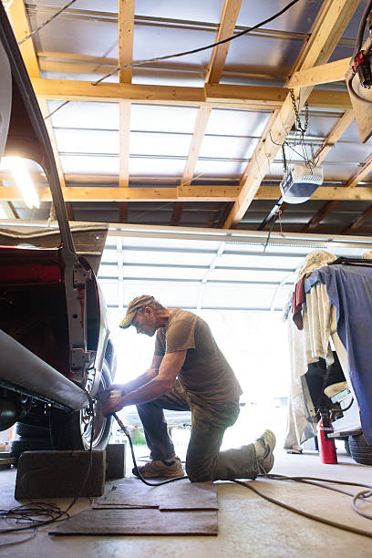istock Mechanic working in garage shop 626291156