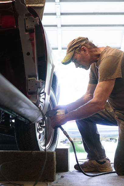 istock Mechanic working in garage shop 626291174