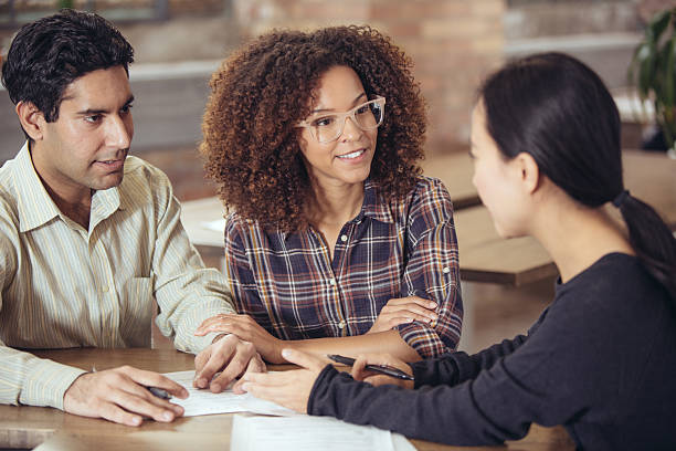 istock Couple talking to bank manager 626291664