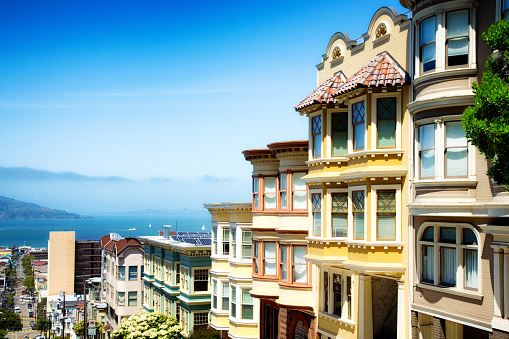 Colorful San Francisco building tops with Bay on a Sunny day. Oblique view with copy space.