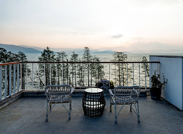 istock Two empty chairs on roof of building 626292192