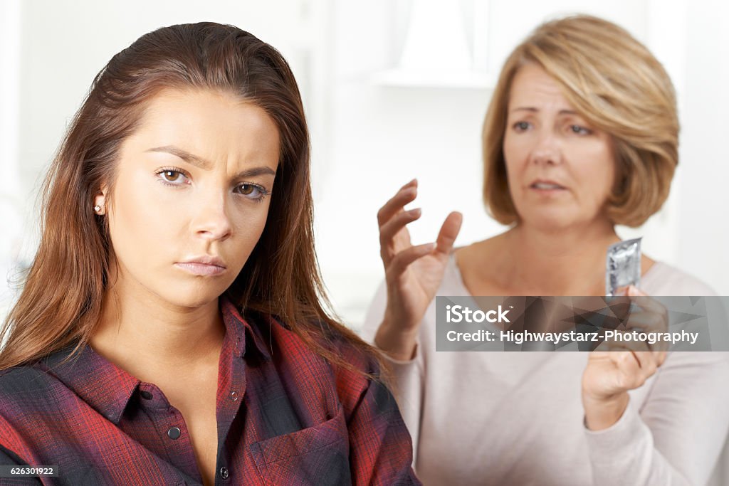 Mother Talking To Teenage Daughter About Contraception 18-19 Years Stock Photo
