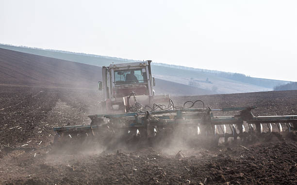 istock Harrowing the soil with disc harrows 626303080
