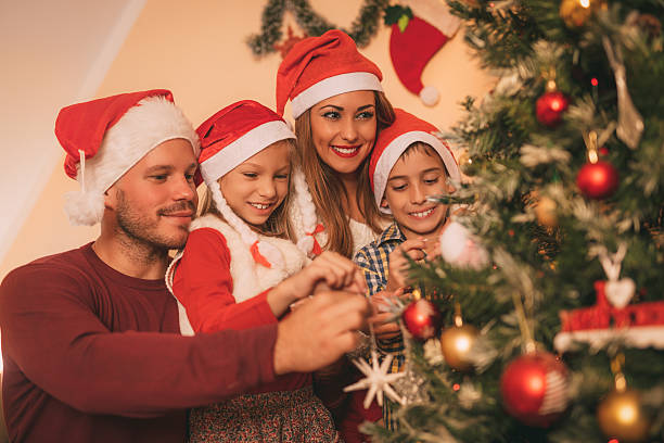 istock Family Decorating Christmas Tree 626304482