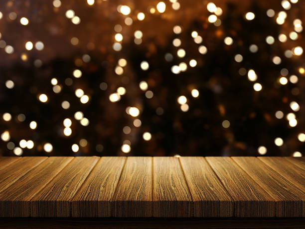 istock Wooden table with defocussed Christmas image 626305228