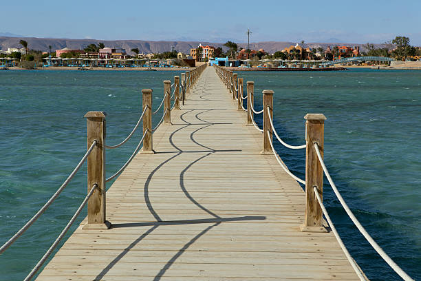 istock Long wooden pier into the sea. 626310506