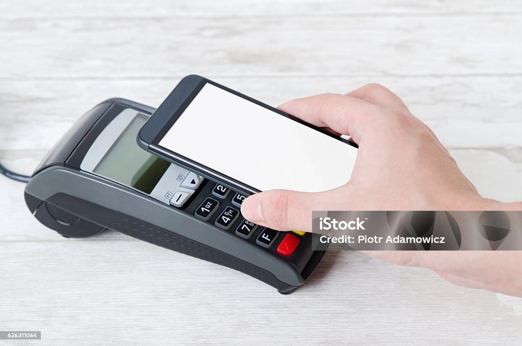 Mobile payment with smart phone Mobile payment with smart phone. payment nfc near field communication phone credit card concept Agricultural Field Stock Photo