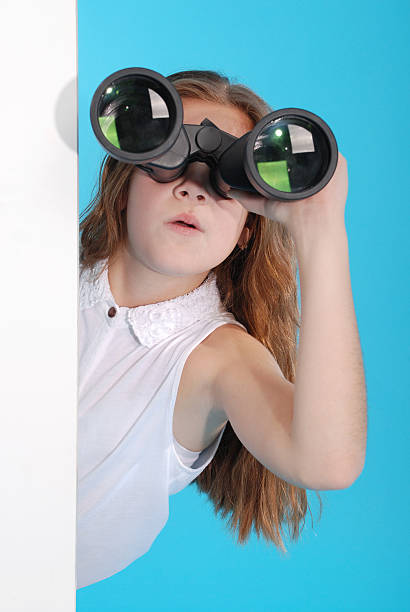 若い女の子、双眼鏡 - corner child hiding looking ストックフォトと画像