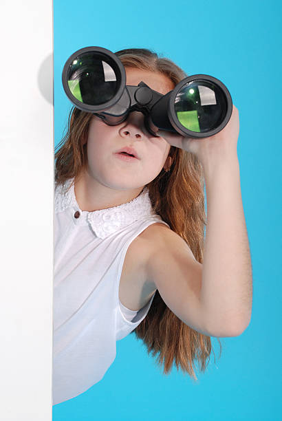 istock Young girl with binoculars 626321214