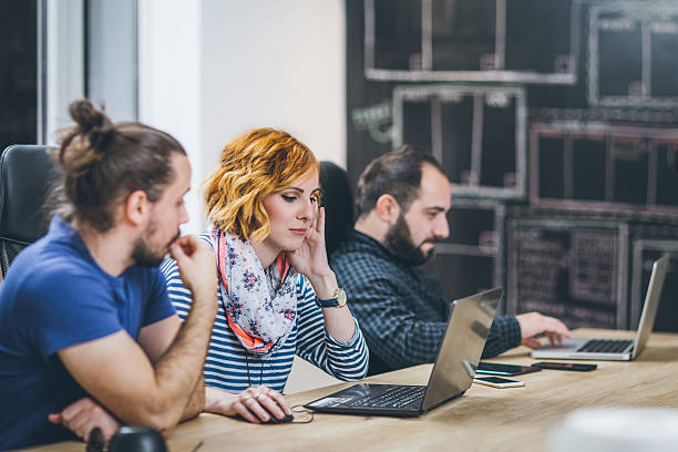istock Casual business people working together with computer in office 626321630