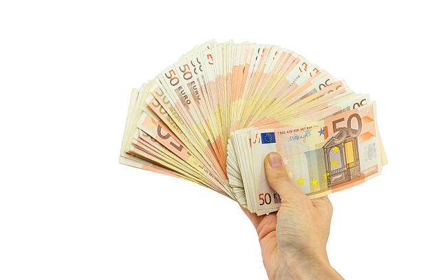 istock Hand holding stack of fifty euro notes on white 626322344