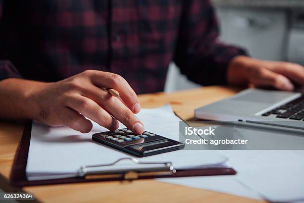 Close Up Of A Hand On A Calculator Stock Photo - Download Image Now - Home Finances, Marketing, Calculator