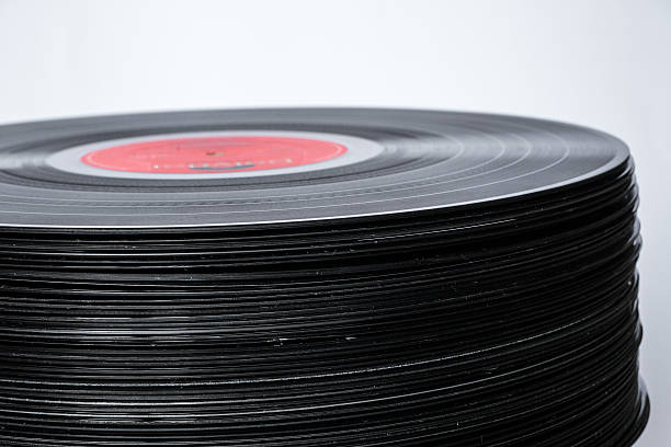 istock Old Stacked Vinyl Records with white background 626330924