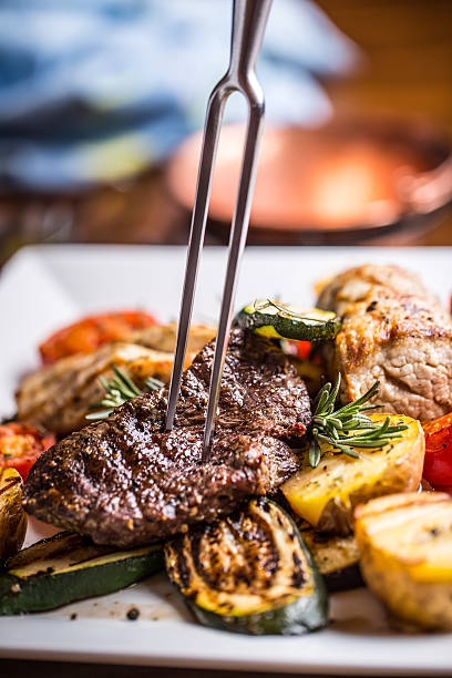 istock Beef Steak. Sirloin steak. Delicious juicy beef steak on fork. 626333186