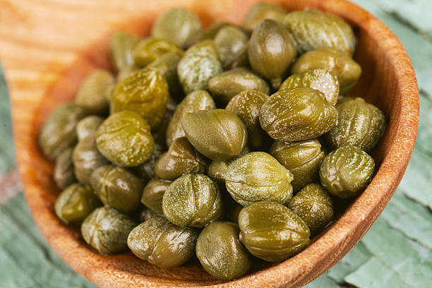 istock capers in a wooden spoon 626333284