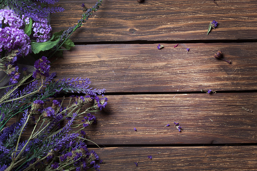 bunch of lavender lying on the brown wooden table