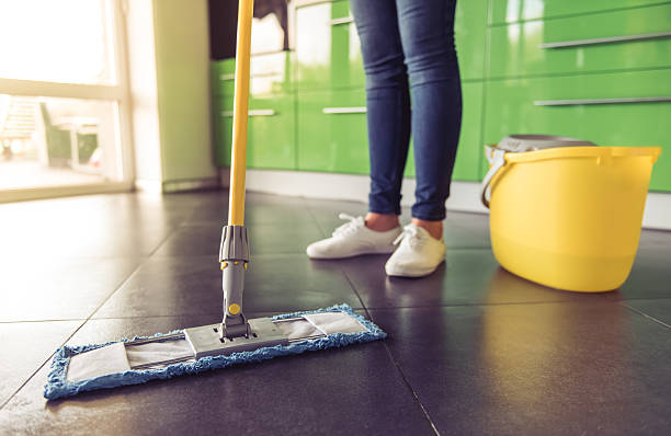 istock Woman cleaning her kitchen 626348322