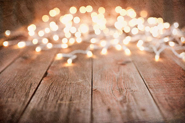 istock Environmentally Friendly Christmas Lights Old Wood Background 626348498