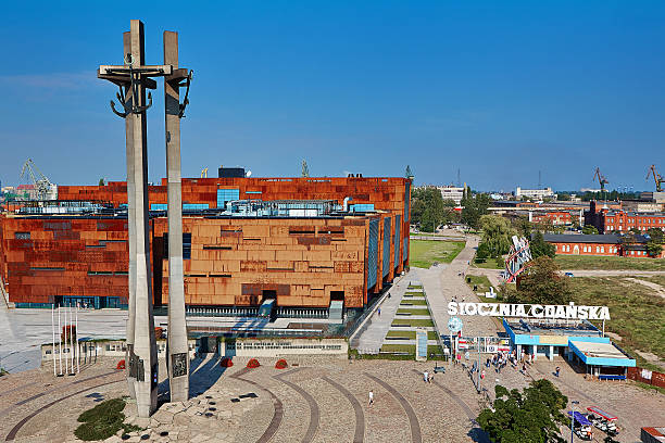 Gdansk Shipyard Gdansk, Poland - September 09, 2016, Stocznia Gdanska: Monument to the fallen shipyard workers,  European Solidarity Centre and the historic Gate No. 2 (main gate) solidarity labor union stock pictures, royalty-free photos & images