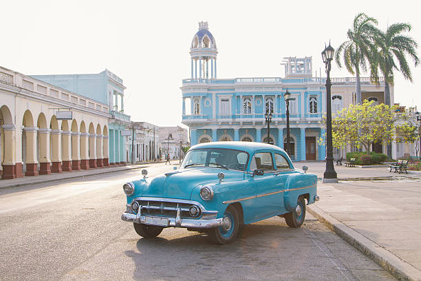 Vintage car in Jose Marti square, Cienfuegos, Cuba Cienfuegos, town square, vintage car cuba stock pictures, royalty-free photos & images