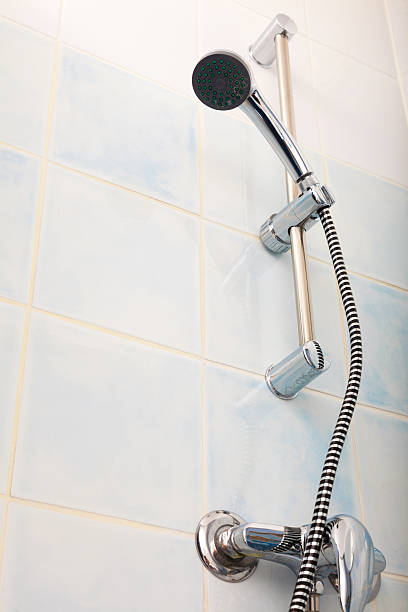 istock Closeup of shower head in bathroom. 626351586