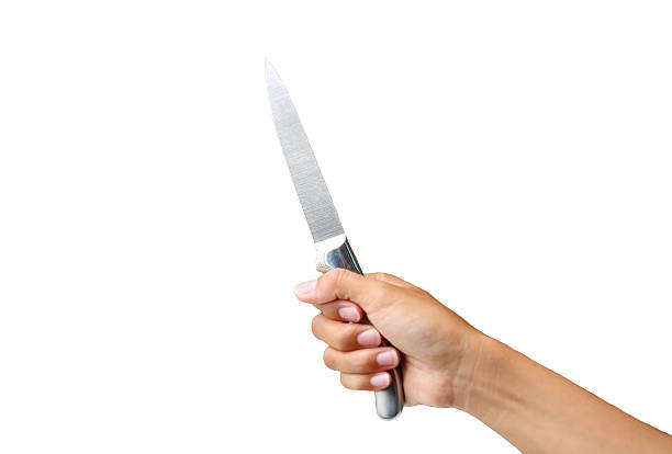 istock hand holding knife on white background 626351952