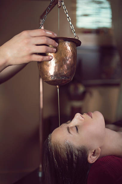 istock Ayurvedic Shirodhara Treatment 626353524
