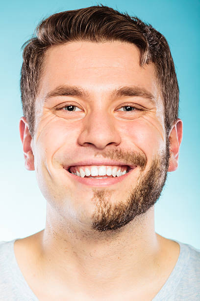 istock Happy man with half shaved face beard hair. 626353852